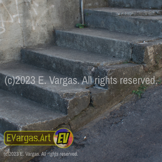 steps of a staircase in the sidewalk on street, asphalt