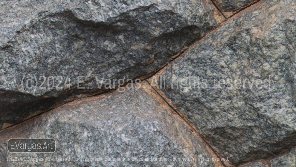 close-up of rocks on a wall, street, outdoors, daylight, zoom