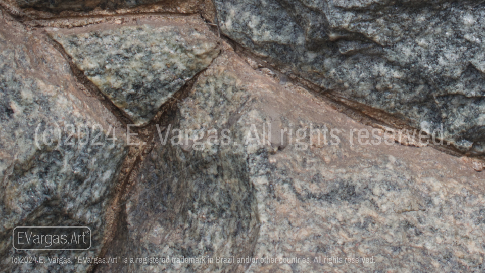 close-up of rocks on a wall, street, outdoors, daylight, zoom