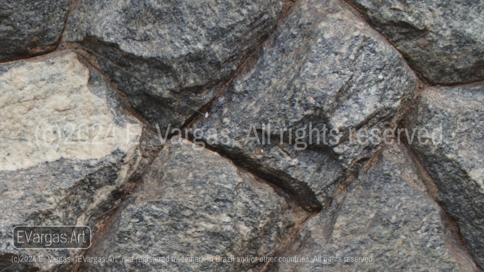 close-up of rocks on a wall, street, outdoors, daylight, zoom