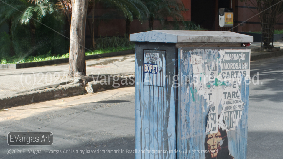 street box, asfalt, street, trees, cars in distance, urban scene, daylight, outdoors