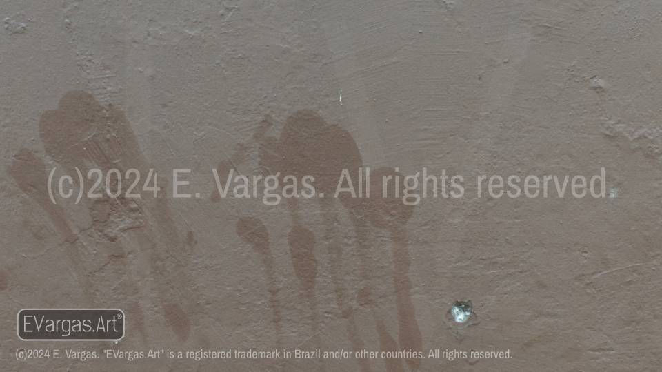 hand-shaped stains on the wall, brown wall, street wall, outdoors, day, sunlight, urban, street