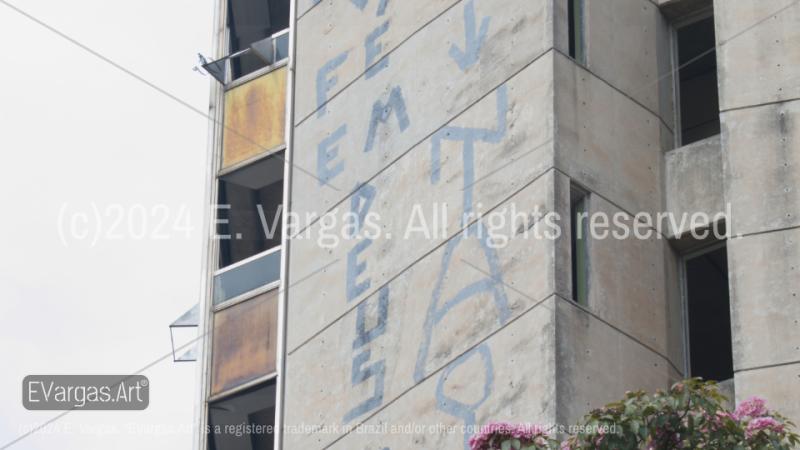 abandoned building with graffiti on it, street art, close-up, zoom, gray colors, windows, day, outdoors, street, urban, clear sky