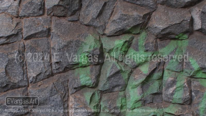 close-up of rocks on a wall, street, outdoors, daylight, zoom