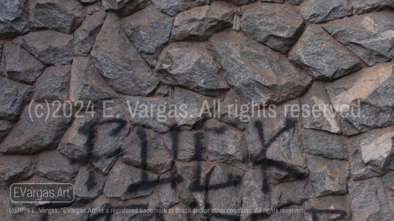 close-up of rocks on a wall, street, outdoors, daylight, graffiti on the wall, fuck, fuck word, f word, urban